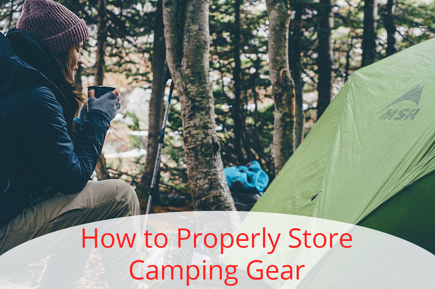 A woman in a blue jacket, purple beanie, and tan pants, sits on a log and stares at her green tent, wondering how to properly store camping gear.