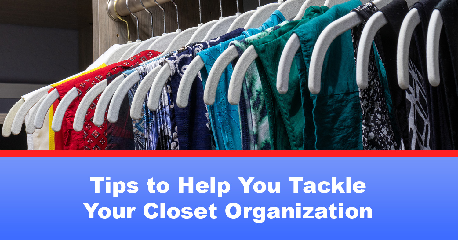 An example of closet organization, with clothes arranged by color on matching hangers.