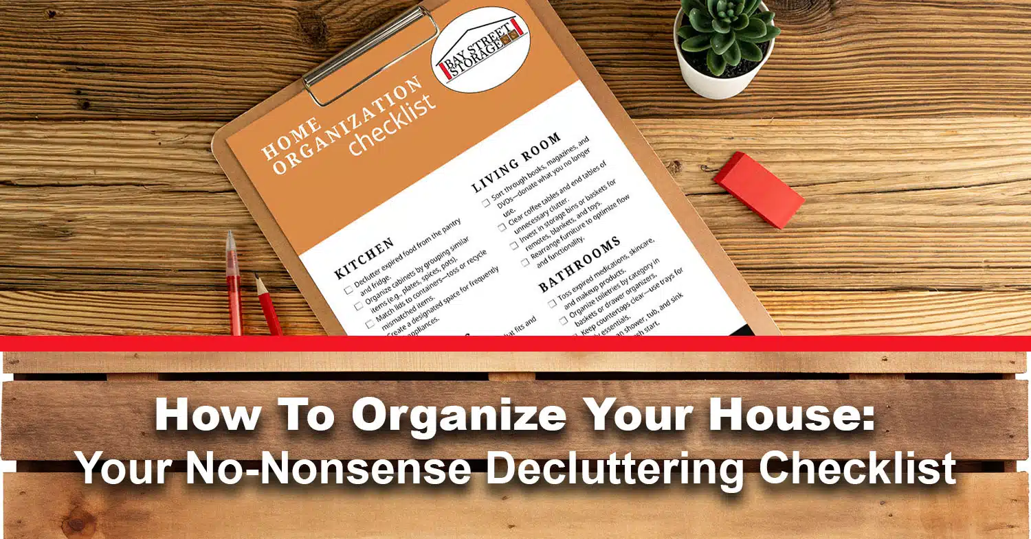 Bay Street Storage's home organization checklist shown on a clipboard on wood desk